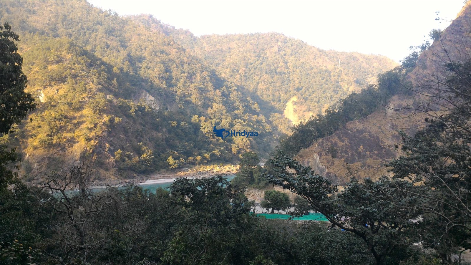 Quiet riverside view at Phool Chatti near Rishikesh with calm Ganga flow and minimal surroundings