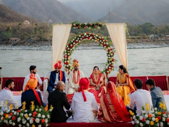 Families enjoying a calm wedding celebration in Rishikesh