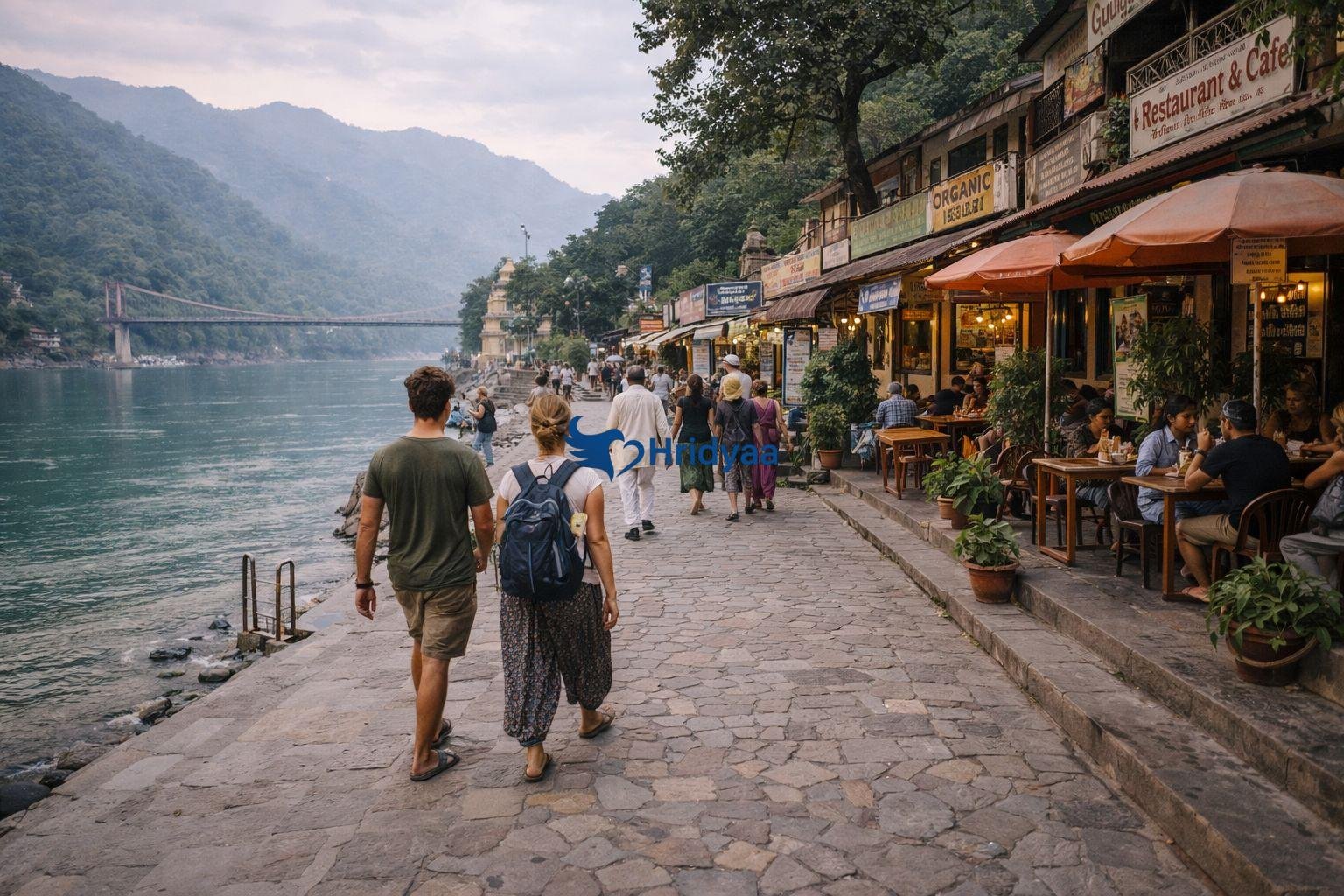 people walking near ram jhula ghats with small cafes and shops