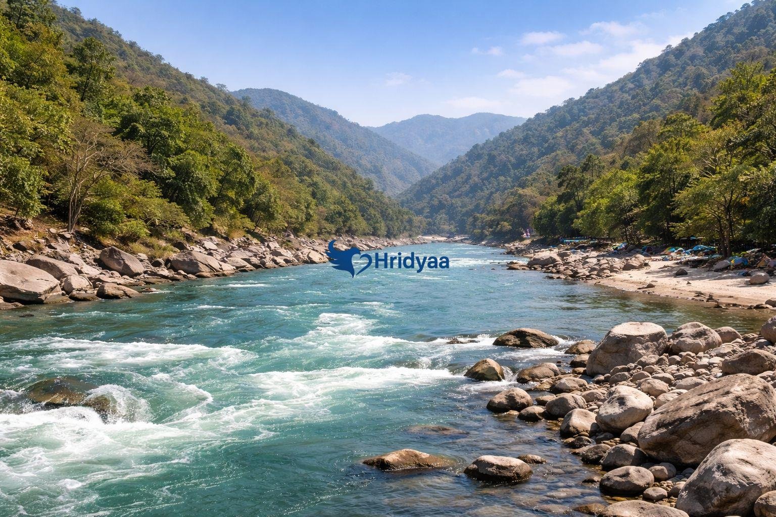 Scenic view of the Ganga river valley surrounded by Himalayan foothills in Rishikesh